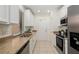 Clean kitchen design with white cabinets and stainless steel appliances at 4225 Overture Cir, Bradenton, FL 34209