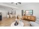 Inviting living room with wood floors and a view of the adjacent dining room at 4225 Overture Cir, Bradenton, FL 34209