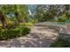 A beautifully landscaped community walkway with seating at 4225 Overture Cir, Bradenton, FL 34209