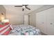 Neutral bedroom with large closet, coastal accents, and light wood laminate flooring at 4380 Exeter Dr # H202, Longboat Key, FL 34228