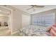 Comfortable bedroom featuring a closet, ceiling fan, leafy comforter and tranquil view at 4380 Exeter Dr # H202, Longboat Key, FL 34228