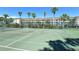 Well-maintained tennis court surrounded by lush landscaping and condos offers an active and engaging lifestyle at 4380 Exeter Dr # H202, Longboat Key, FL 34228