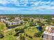 Aerial view of condos amidst a lush golf course with winding ponds and scenic views of the community at 4410 Fairways Blvd # 605, Bradenton, FL 34209