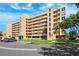 A large condo building with parking in front is enhanced by lush landscaping at 4410 Fairways Blvd # 605, Bradenton, FL 34209