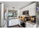 Updated kitchen with stainless steel appliances, granite counters, and modern light fixture at 4410 Fairways Blvd # 605, Bradenton, FL 34209