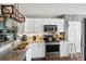 Updated kitchen featuring stainless steel appliances and granite counters at 4410 Fairways Blvd # 605, Bradenton, FL 34209