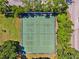 Aerial view of tennis and pickleball courts surrounded by trees at 4410 Fairways Blvd # 605, Bradenton, FL 34209