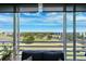 Expansive view of the golf course and beautiful blue skies from the large sliding glass doors at 4410 Fairways Blvd # 605, Bradenton, FL 34209