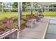 Inviting benches offer a relaxing spot amidst the lush landscaping of this residential community at 4885 1St Ne St # 308, St Petersburg, FL 33703