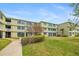 Beautiful building exterior featuring mature landscaping at 4885 1St Ne St # 308, St Petersburg, FL 33703