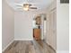 Open-concept living area featuring wood-look floors and a view into the kitchen at 4885 1St Ne St # 308, St Petersburg, FL 33703
