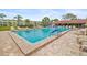 Community pool with many lounge chairs for residents, close to buildings in complex at 4885 1St Ne St # 308, St Petersburg, FL 33703