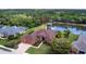 Aerial shot showcases a single-Gathering home with a pond view and a well-manicured lawn at 5391 90Th Avenue E Cir, Parrish, FL 34219