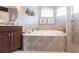 Bathroom featuring a large soaking tub, vanity, and walk-in shower at 5391 90Th Avenue E Cir, Parrish, FL 34219