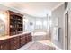 Bathroom featuring a large soaking tub, vanity with storage, and neutral color palette at 5391 90Th Avenue E Cir, Parrish, FL 34219