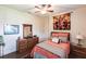 Comfortable bedroom features a ceiling fan, dresser and nightstands at 5391 90Th Avenue E Cir, Parrish, FL 34219