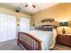 Comfortable bedroom with a full-sized bed, ceiling fan, and neutral decor at 5391 90Th Avenue E Cir, Parrish, FL 34219