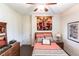 This bedroom has a ceiling fan, a tapestry and coordinating decor at 5391 90Th Avenue E Cir, Parrish, FL 34219