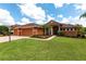 Beautiful single-story home with manicured landscaping and a paver driveway at 5391 90Th Avenue E Cir, Parrish, FL 34219