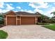 Charming single-story home with a three-car garage and paver driveway at 5391 90Th Avenue E Cir, Parrish, FL 34219