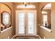 Elegant glass double front door with decorative sidelights at 5391 90Th Avenue E Cir, Parrish, FL 34219