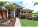 Inviting front entrance with a brick walkway and lush landscaping at 5391 90Th Avenue E Cir, Parrish, FL 34219