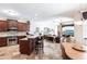 Open concept living space with kitchen counter and bar stools visible and living room beyond at 5391 90Th Avenue E Cir, Parrish, FL 34219