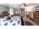 Comfortable main bedroom with wood furniture, ceiling fan, and ensuite bath at 5391 90Th Avenue E Cir, Parrish, FL 34219