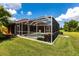 A screened-in pool and patio area offer a private outdoor space for relaxation and entertainment at 5391 90Th Avenue E Cir, Parrish, FL 34219