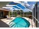 Relaxing screened-in pool with views of the surrounding landscape at 5391 90Th Avenue E Cir, Parrish, FL 34219