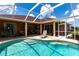 Inviting screened-in pool area perfect for relaxation and outdoor enjoyment at 5391 90Th Avenue E Cir, Parrish, FL 34219