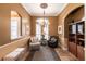 Cozy sitting room with a chandelier and ample natural light at 5391 90Th Avenue E Cir, Parrish, FL 34219