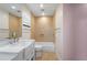 Bathroom featuring a bathtub and shower combination, a single sink vanity, and ample lighting at 6217 Goldfinch St, Sarasota, FL 34241