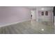 Spacious bedroom with sleek tile flooring, closet with mirrored doors, and fresh paint at 6217 Goldfinch St, Sarasota, FL 34241