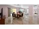 Bright dining room boasts tile floors, a sliding door to the yard, and seamless access to the kitchen at 6217 Goldfinch St, Sarasota, FL 34241