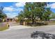 Charming property with a well-manicured lawn, fenced yard, and a detached garage at 6217 Goldfinch St, Sarasota, FL 34241