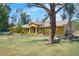 Charming single story home with manicured lawn and lush tropical landscaping at 6217 Goldfinch St, Sarasota, FL 34241