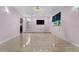Bright open room with tile flooring, large window, and stylish chandelier at 6217 Goldfinch St, Sarasota, FL 34241
