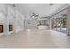 Expansive living area featuring archways, tile floors, and a wet bar at 6217 Goldfinch St, Sarasota, FL 34241