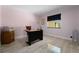 Bright office space featuring tile flooring, neutral walls, and a window for natural light at 6217 Goldfinch St, Sarasota, FL 34241