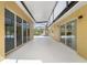 Long covered patio with sliding glass doors and screened enclosure at 6217 Goldfinch St, Sarasota, FL 34241
