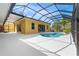 Outdoor pool area featuring a pool, patio, and screened enclosure with natural light at 6217 Goldfinch St, Sarasota, FL 34241