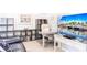 Cozy home office featuring modern desk, comfortable chair, and entertainment center at 6334 Grand Oak Cir # 202, Bradenton, FL 34203