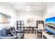 Inviting home office with stylish decor, comfortable seating, and ample storage shelves at 6334 Grand Oak Cir # 202, Bradenton, FL 34203