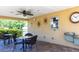 Covered outdoor patio area with seating, ceiling fan, and convenient access to community amenities at 6334 Grand Oak Cir # 202, Bradenton, FL 34203