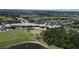 Gorgeous aerial view of the community clubhouse, pool, tennis courts, and golf course at 6740 Willowshire Way, Bradenton, FL 34212