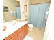 Bathroom with vanity, decorative nautical accents, and tub with shower at 6740 Willowshire Way, Bradenton, FL 34212