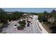 Impressive aerial view of the community's stone-covered entry gate featuring manicured landscaping at 6740 Willowshire Way, Bradenton, FL 34212