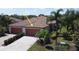 Beautiful home with a terracotta roof, two-car garage, and well-maintained landscaping at 6740 Willowshire Way, Bradenton, FL 34212