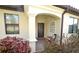 Charming front entrance with brick walkway, decorative window, and covered porch at 6740 Willowshire Way, Bradenton, FL 34212